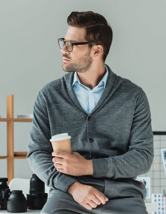 handsome-male-photographer-with-coffee-working-in-2022-12-16-18-18-50-utc-e1697778872784.jpg
