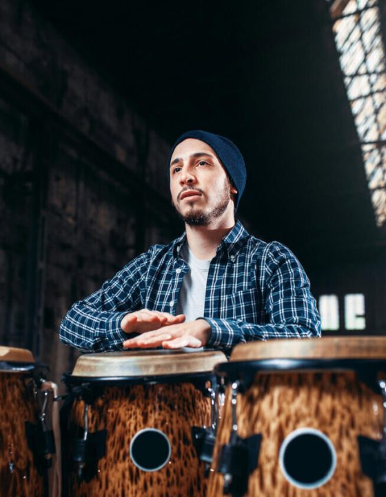 male-drummer-plays-on-wooden-drum-2021-08-26-16-26-01-utc-e1697779026137.jpg